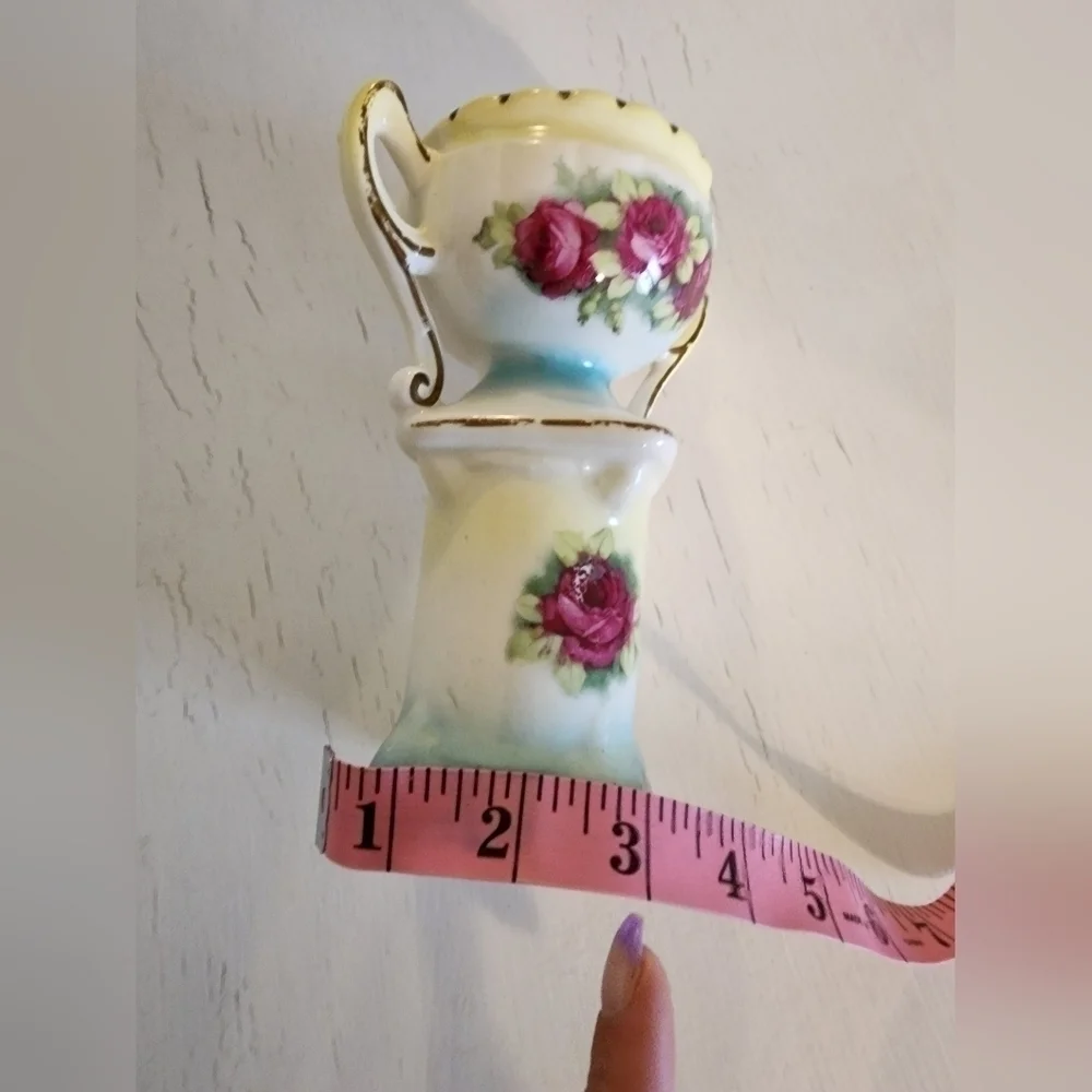 Vintage hand-painted porcelain urn/vase on pillar.